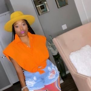 Virtuous Top is a Button up vest.